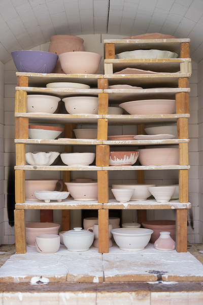 ceramic bowls and vessels on shelf